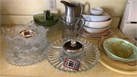 Assorted glass serving bowls, pitchers, lazy