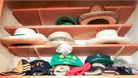 Three shelves of hats and gloves