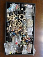 Beads and broken jewelry pieces