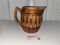 brown barrel pitcher