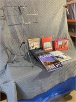 Music stand, several hard cover books and a puzzle