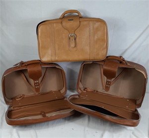 Three leather suitcases