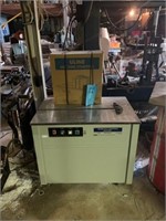 ULINE H-959 STRAPPING MACHINE WITH