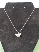 Silver colored silver flying pig charm and