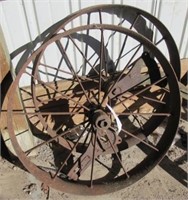 (2) Antique steel wheels. Measures 30" diameter.