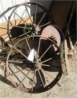(2) Antique steel wheels and (2) implement steel