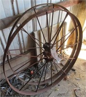 (2) Antique steel wheels. Measures 40" diameter.