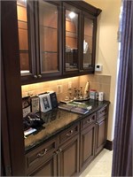 Butlers Kitchen cabinets with granite countertop.