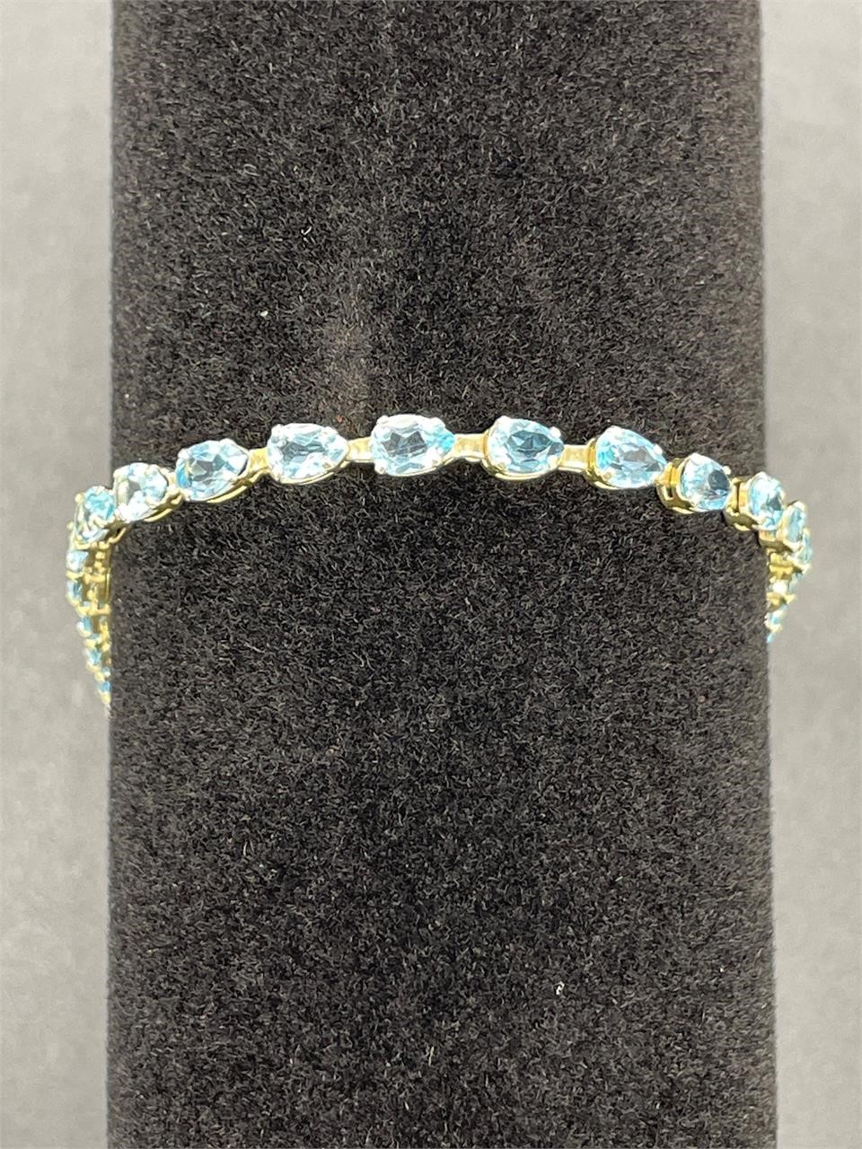 14k gold bracelet w/ 24 blue gemstones