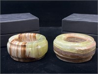 2 carved onyx candle holders.