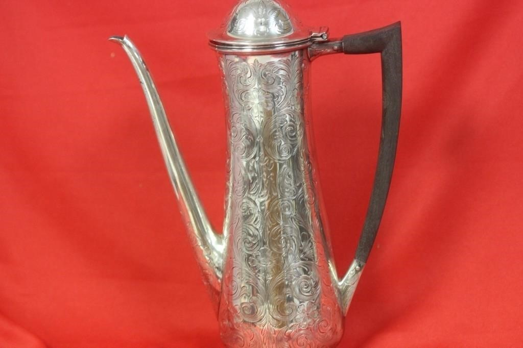 A Handcarved Sterling Teapot