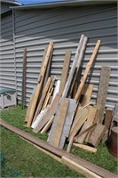 Pile of used lumber assorted sizes
