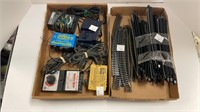 Box of train tracks and controllers