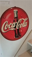 Round coca-Cola sign