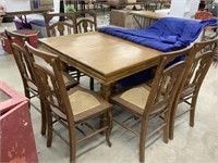 Oak table with 6 cane seat chairs (damage on 2