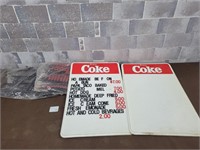 Coca-Cola signs with letters and numbers
