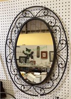 Beautiful oval metal mirror - surrounding