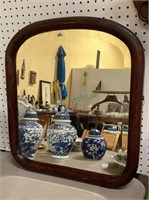Beautiful uniquely shaped beveled mirror in a
