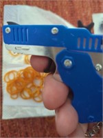 New chrome & blue folding rubber band gun with a