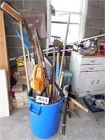 TRASH CAN FULL OF OUTDOOR TOOLS