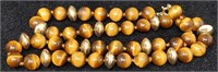 Tiger eye necklace with 14k gold beads, 21"l.