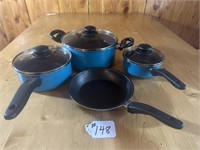 FOUR PIECES OF COOKWARE WITH LIDS
