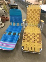 Two folding  patio loungers