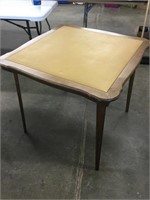 Wooden folding table with vinyl top