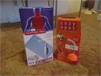 Conair heating pad in box and Cozy Spot