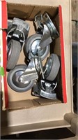 Box of  4 inch swivel casters with locks
