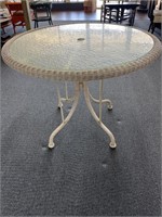 Wicker with glass top outdoor dining table