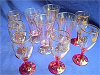 6 wine glass with ruby stems and gold pattern