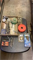 Spark plugs, drill bits, level, lock, wood