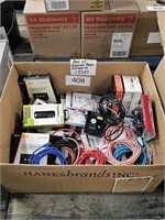 box of assorted phone accessories