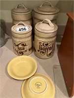 Ceramic 4-pc canister set & 2 yellow Fiesta bowls