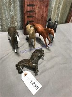 4 assorted small breyer horses, one iron horse