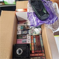 Box of puzzles, coin safe, books and misc.