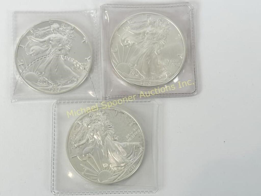 THREE 1 OZ AMERICAN EAGLE SILVER COINS