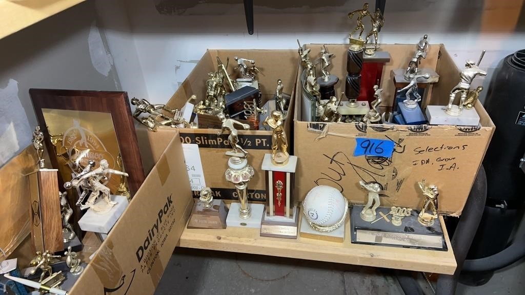 Old trophies: bowling , softball, golfing