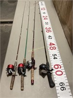 Four fishing poles and reels. Spin casting reels.