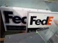 PAIR OF FED EX SIGNS