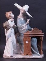 A 14" high Lladro porcelain figurine of nun