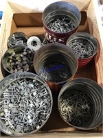 Box of metal cans containing nails