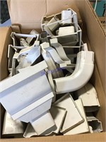 Box of plastic guttering pieces