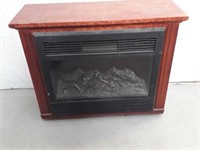 Electric fireplace in wooden case turns on blows