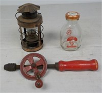 Vintage hand drill, gas lantern and mill bottle.