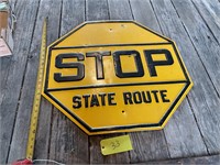 Vintage yellow painted meatal stop sign