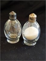 Glass salt and pepper shaker with sterling silver