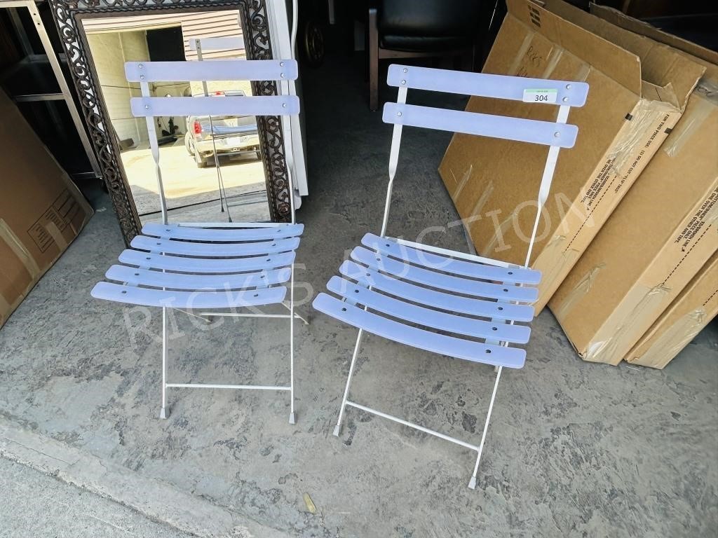 pair of folding metal frame deck chairs