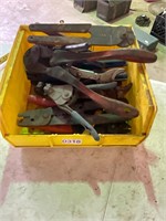 Yellow bin of pliers, cutters, crimpers. all